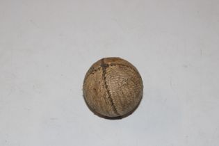 A small sewn leather and feather hand ball