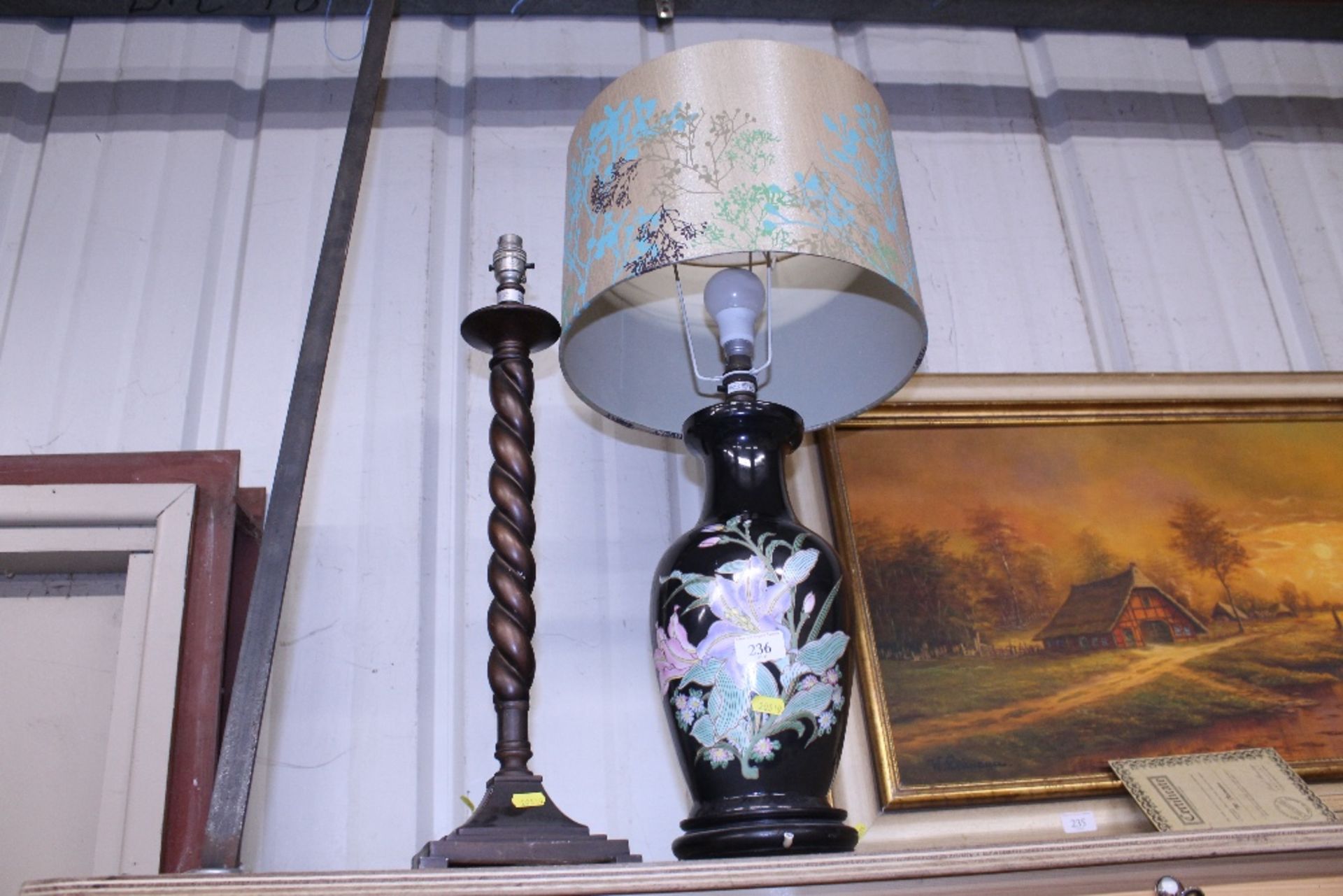 A floral decorated baluster table lamp with shade;