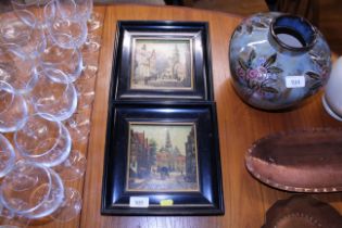 A pair of continental painted tile pictures depict