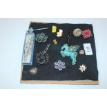A quantity of various brooches including turquoise