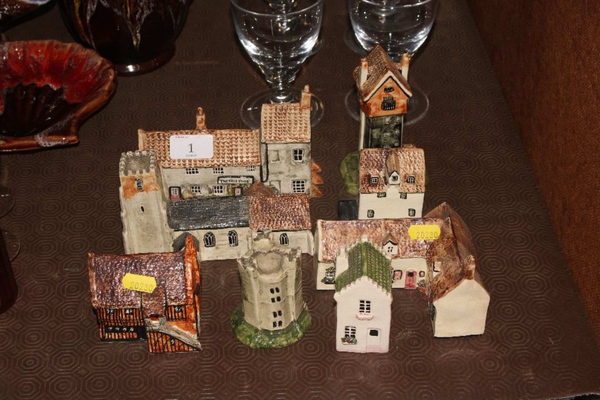 A small collection of model pottery cottages includ