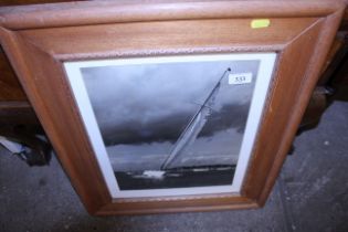 A framed photograph of a racing yacht