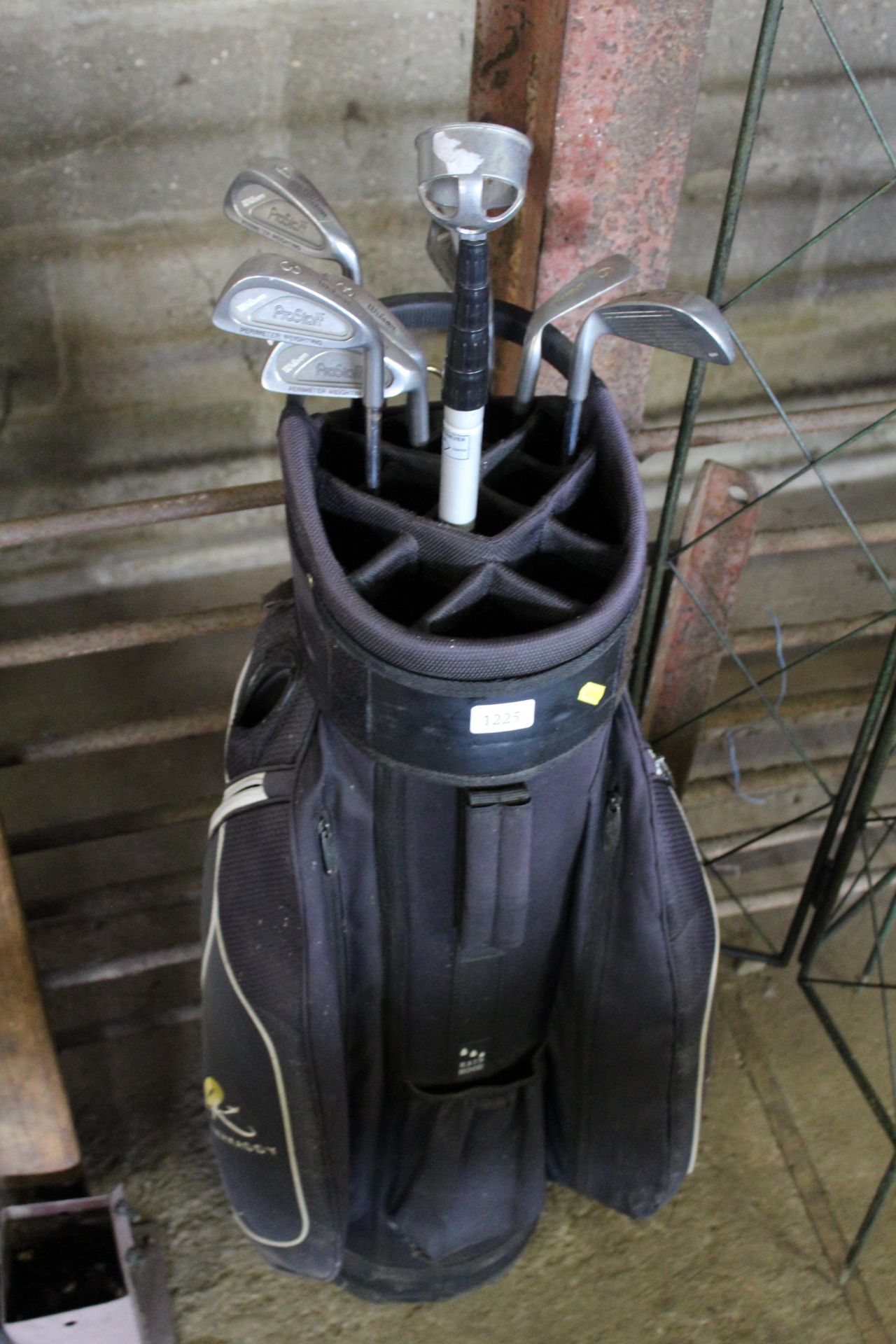 A golf bag and contents of golf clubs to include W