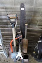 A quantity of gardening tools to include saw, two