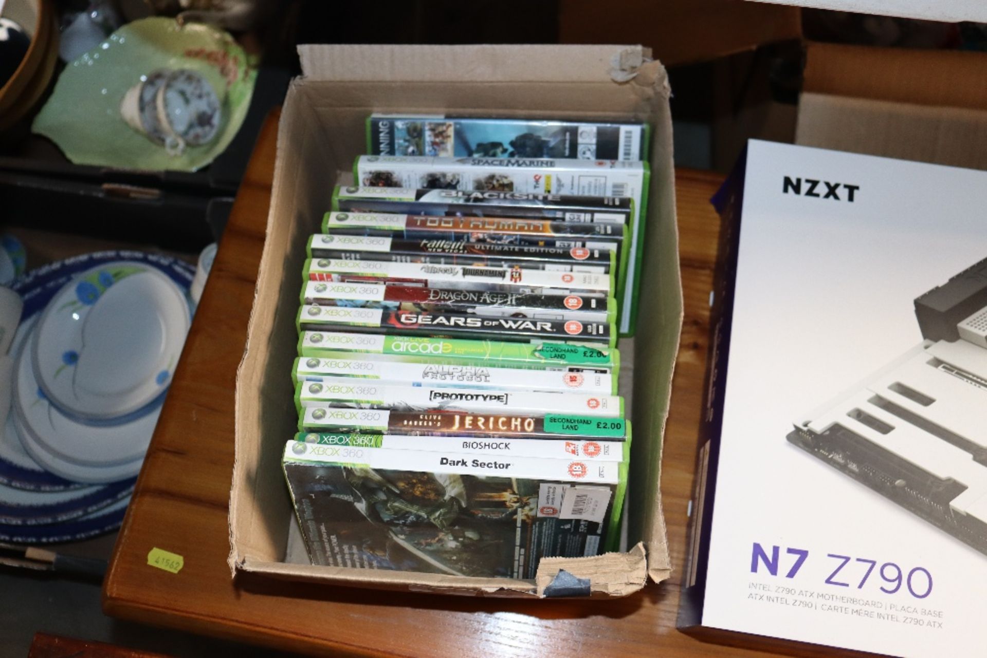 A box of Xbox 360 games