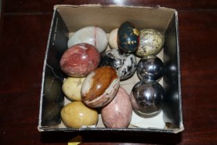 A collection of onyx eggs; musical metal spheres e