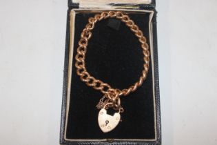 A gold bracelet with 15ct gold padlock clasp, appr