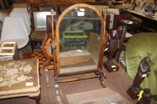 A mahogany and boxwood strung swing toilet mirror; and another similar