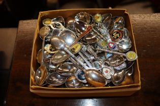 A collection of various souvenir spoons