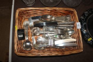 A basket of plated "Kings" pattern cutlery