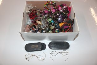 A box of various costume jewellery and two pairs o