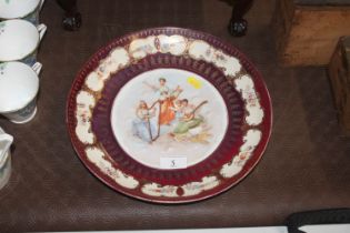 A Continental porcelain shallow dish decorated wit