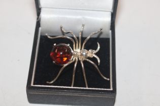 A Hallmarked Sterling silver and amber set spider