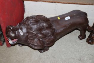 A large carved wooden lion ornament