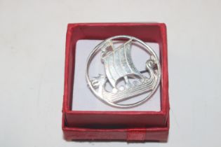 A Sterling silver brooch in the form of a Viking ship