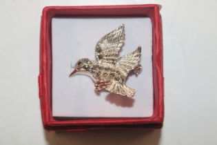 A Sterling silver and marcasite set humming bird b