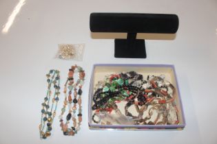 A box containing various costume jewellery, mainly