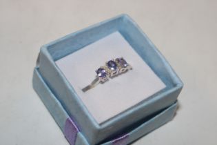 A Sterling silver tanzanite and chip diamond set r