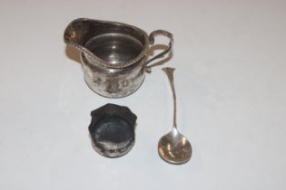 A silver cream jug; a small silver salt; and a sil