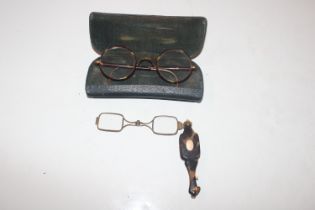 A pair of 10ct gold plated spectacles; and a pair