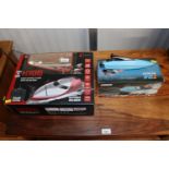 A radio controlled speed boat and one other