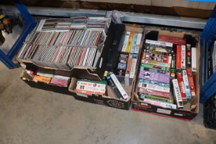 Four boxes of CDs and VHS tapes