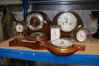 A quantity of various mantel clocks and two barome