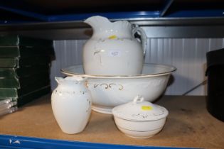 A wash jug and bowl set comprising of jug, bowl, t