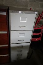 A metal four drawer filing cabinet