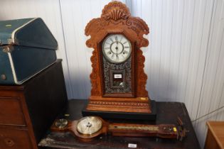 A Weathermaster barometer and an oak cased two hole clock