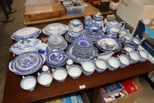 A large quaintly of patterned blue and white china