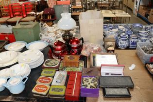 A collection of advertising tins, insulated tea wa