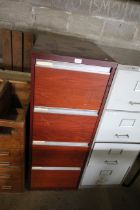 A four drawer filing cabinet (locked no key)