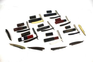 A collection of vintage cut throat razors, some bo