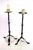 A pair of antique iron candlesticks with twist dec
