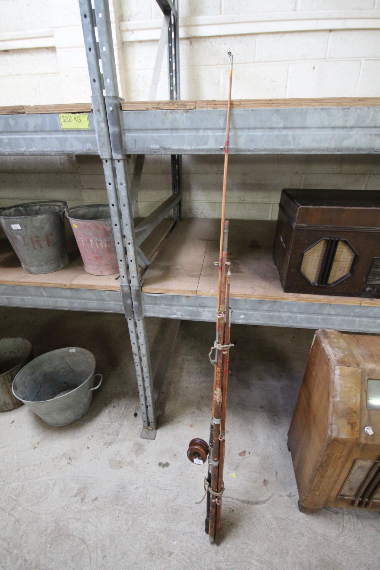 Various split cane fishing rod parts and a wooden