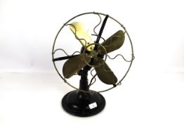 A vintage fan with brass blades - sold as a collec