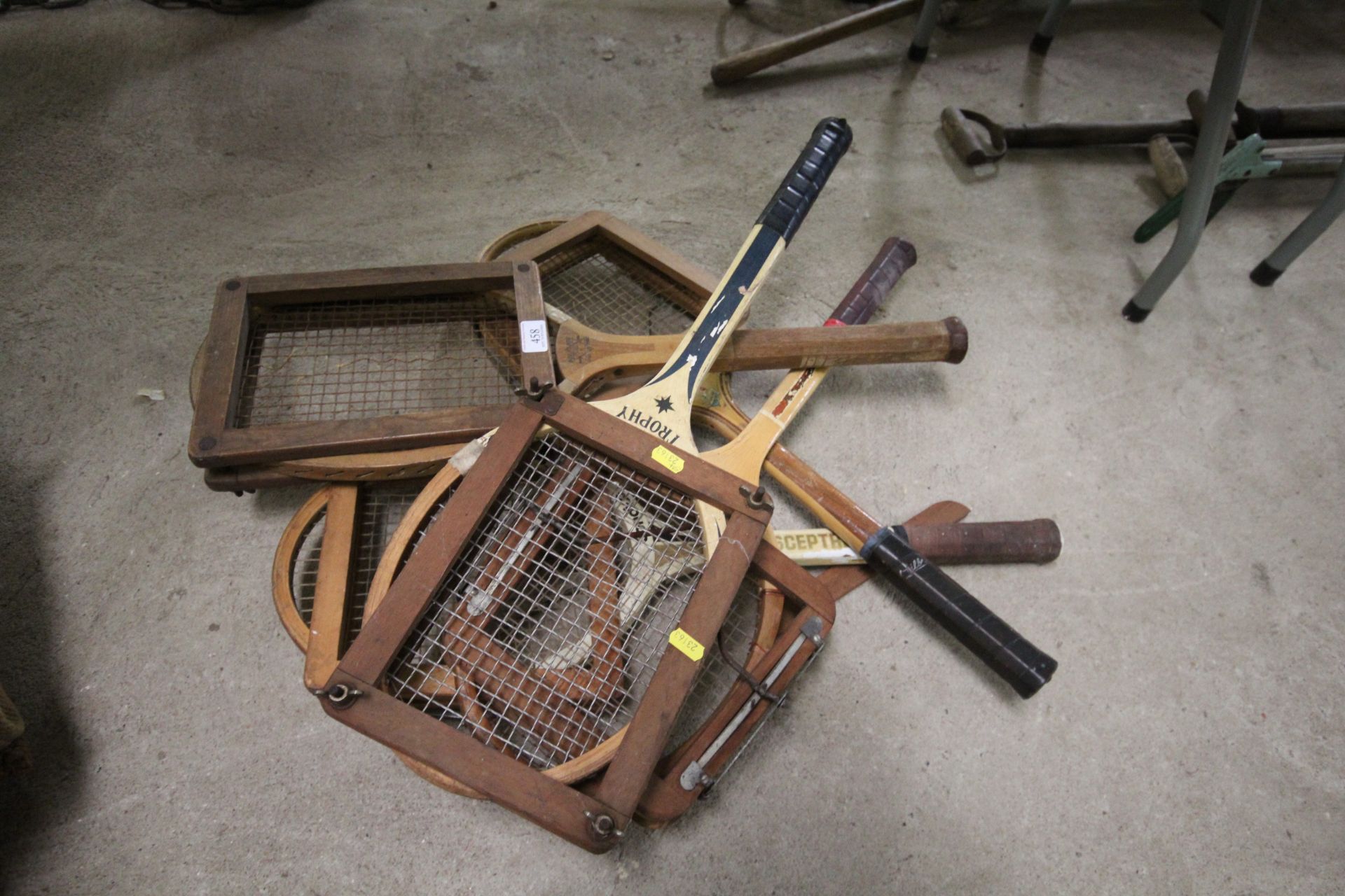 Five miscellaneous wooden tennis rackets with clam