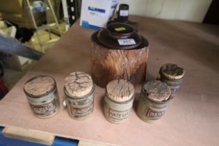 A rustic wooden tobacco jar and five Studio Potter