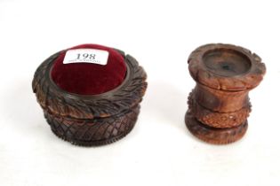 Two 19th Century carved Aquila nut pin cushions