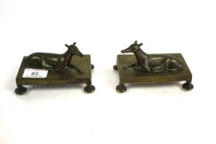 A pair of Victorian brass greyhound ornaments