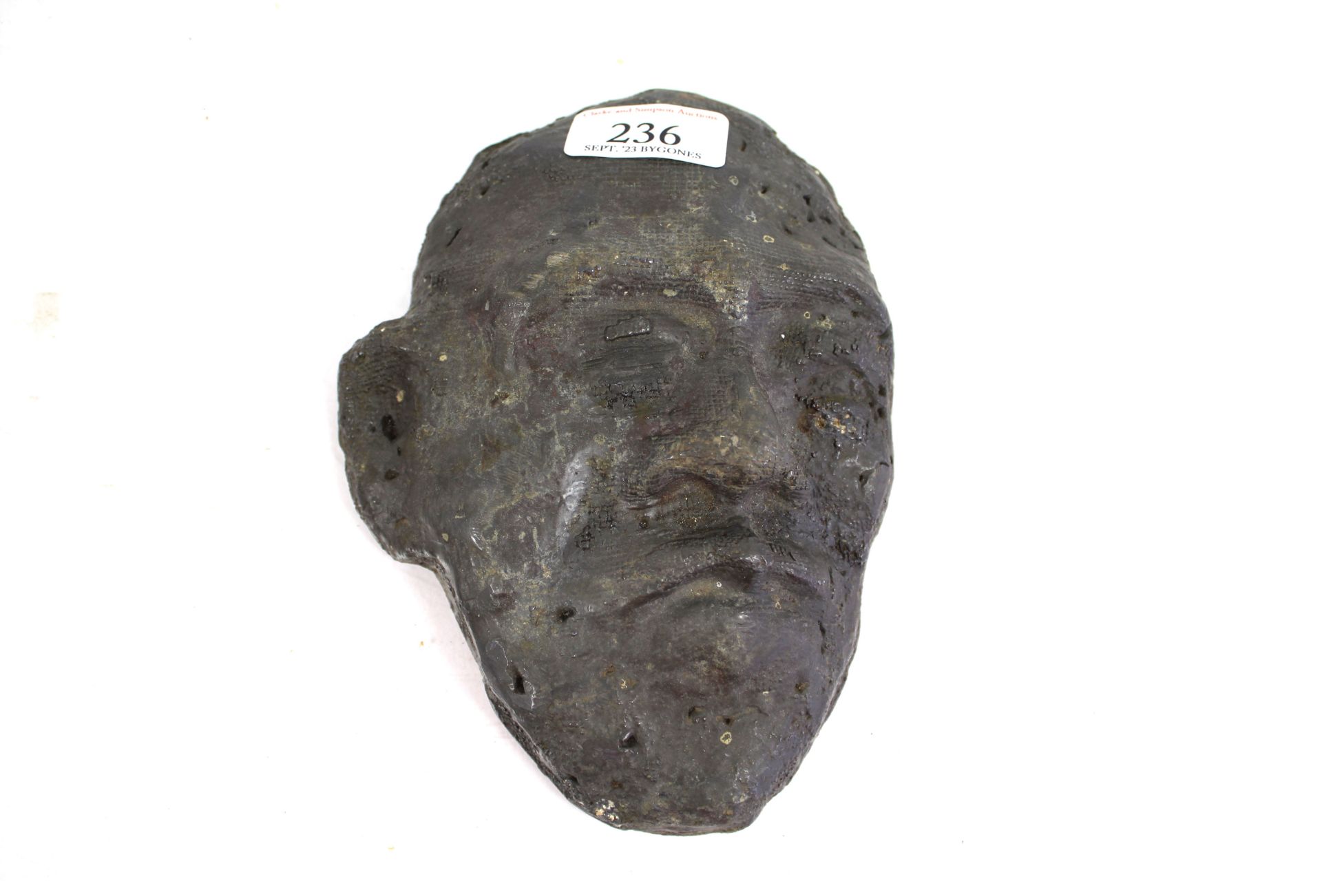 An antique lead mask