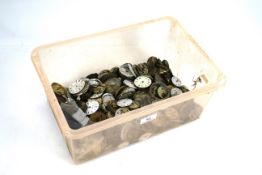 A box of miscellaneous pocket watch movements and