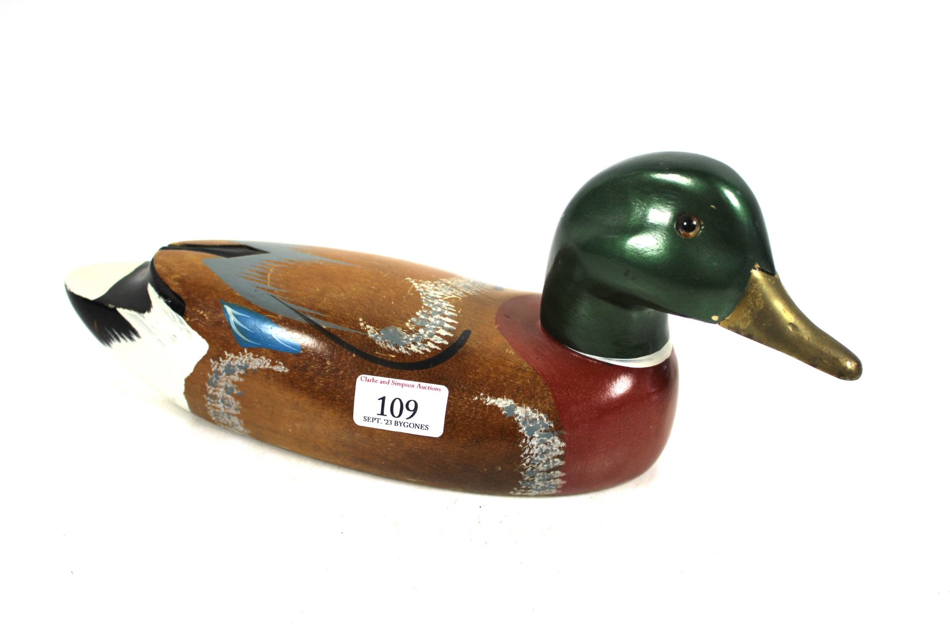 A large wooden decoy duck