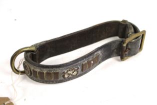 A vintage leather and brass dog collar
