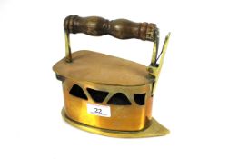 An antique brass box iron