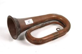 An antique copper bugle
