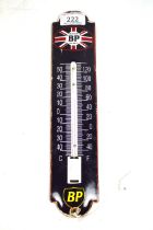 An enamel garage advertising thermometer for Motor