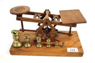 An unusual set of wooden postal scales with a set