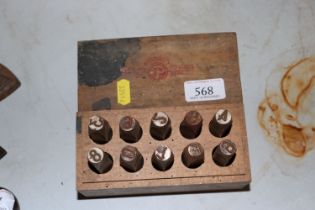 A set of priority marking punches in storage box